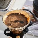 Brown filter paper coffee cone – kitchen brewing accessory by Decorbites