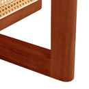 A natural and elegant deep red wooden coffee table with artificial rattan decorations, perfect for a fashionable living room and comfortable tea drinking time