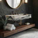 Modern bathroom with marble sink, wooden vanity, and dark walls.