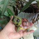 Charming green & pink crawling turtle sculpture garden decor by Decorbites