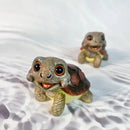 Charming green & pink crawling turtle sculpture garden decor by Decorbites