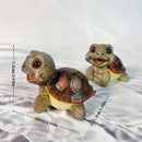 Charming green & pink crawling turtle sculpture garden decor by Decorbites
