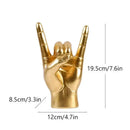 Chic black glossy rock hand gesture sculpture living room decor by Decorbites