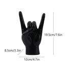 Chic black glossy rock hand gesture sculpture living room decor by Decorbites