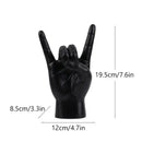 Chic black glossy rock hand gesture sculpture living room decor by Decorbites