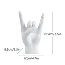 Chic black glossy rock hand gesture sculpture living room decor by Decorbites