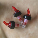 Clear and red plastic liquor pourer bottle dispenser kitchen barware by Decorbites