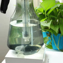 Clear and teal hand trigger watering sprayer garden planting accessory by Decorbites