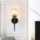GobekUsa Clear Glass Mini Sphere Wall Lamp - Minimalist Living Room Sconce with Pencil Arm in Black/Gold