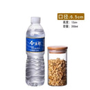 Clear glass storage jars with bamboo lids for kitchen organization by Decorbites