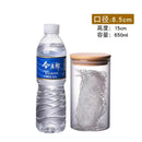Clear glass storage jars with bamboo lids for kitchen organization by Decorbites