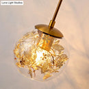 GobekUsa Contemporary 1-Light Clear Glass Bubble Wall Lamp with Foil Flower Decor