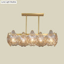 GobekUsa Contemporary Amber Crystal Pendant Light with Brass Island Lighting - 8 Lights, Linear Metal Arm