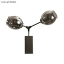 GobekUsa Contemporary Black/Gold Wall Sconce with Oval Amber/Gold/Clear Glass Shade - Elegant Half-Light Wall Mount