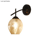 GobekUsa Contemporary Black/Gold Wall Sconce with Oval Amber/Gold/Clear Glass Shade - Elegant Half-Light Wall Mount