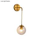 GobekUsa Contemporary Gold Wall Mounted Lamp with Clear Dimpled Blown Glass - Round Sconce