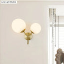 GobekUsa Contemporary White Glass Spherical Sconce with 2 Gold Heads - Wall Mounted Light Fixture