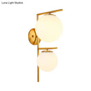 GobekUsa Contemporary White Glass Spherical Sconce with 2 Gold Heads - Wall Mounted Light Fixture