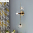 GobekUsa Contemporary Green/Clear Glass Globe Wall Sconce Lamp with 3 Lights in Brass