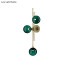 GobekUsa Contemporary Green/Clear Glass Globe Wall Sconce Lamp with 3 Lights in Brass