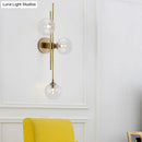 GobekUsa Contemporary Green/Clear Glass Globe Wall Sconce Lamp with 3 Lights in Brass