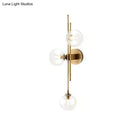 GobekUsa Contemporary Green/Clear Glass Globe Wall Sconce Lamp with 3 Lights in Brass