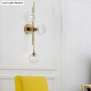 GobekUsa Contemporary Green/Clear Glass Globe Wall Sconce Lamp with 3 Lights in Brass