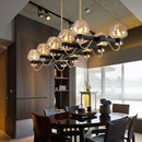 GobekUsa Contemporary Island Lamp: 10 Glass Bulbs in Clear/Amber/Smoke Suspended Fixture - Black/Brass for Bedroom