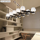 GobekUsa Contemporary Island Lamp: 10 Glass Bulbs in Clear/Amber/Smoke Suspended Fixture - Black/Brass for Bedroom
