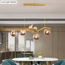 GobekUsa Contemporary Metal Branch Hanging Lamp Island Pendant - 4-Light Black/Gold with Bird Deco and Smoke Grey/Cognac Glass Shade