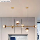 GobekUsa Contemporary Smoke Gray Glass Globe Hanging Light Fixture - 6 Head Gold Island Light