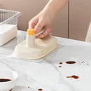 Cream and yellow silicone kitchen cleaning brush with replaceable head by Decorbites