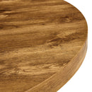 A modern and practical circular dining table. Made of MDF tabletop and wooden MDF table legs. A set of 4 brown cushioned chairs.