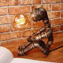 GobekUsa 1-Light Industrial Robot Table Lamp - Antiqued Bronze Metal Nightstand Light for Bedroom