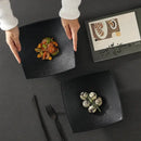 Modern matte black pedestal ceramic dining plate dining room by Decorbites