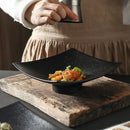 Modern matte black pedestal ceramic dining plate dining room by Decorbites