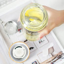 Modern glass water bottle with wood lid and tea filter kitchen accessory by Decorbites