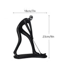 Abstract athlete statue sculpture – black & silver office decor by Decorbites
