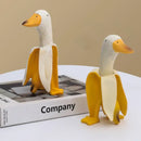 Whimsical white & yellow abstract banana duck sculpture living room decor by Decorbites