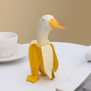 Whimsical white & yellow abstract banana duck sculpture living room decor by Decorbites