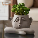 Abstract gray ceramic face flowerpot ornament living room planter by Decorbites