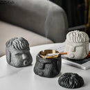 Abstract figure portraits cement ashtray black & gold living room decor by Decorbites