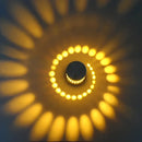 Blue aluminum spiral led wall lamp for bedroom circular light patterns by Decorbites