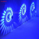 Blue aluminum spiral led wall lamp for bedroom circular light patterns by Decorbites