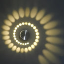 Blue aluminum spiral led wall lamp for bedroom circular light patterns by Decorbites