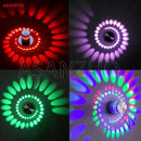 Blue aluminum spiral led wall lamp for bedroom circular light patterns by Decorbites
