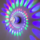 Blue aluminum spiral led wall lamp for bedroom circular light patterns by Decorbites