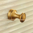 Antique brass robe hook with floral engraving and rope bathroom hook by Decorbites