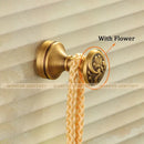 Antique brass robe hook with floral engraving and rope bathroom hook by Decorbites