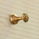 Antique brass robe hook with floral engraving and rope bathroom hook by Decorbites